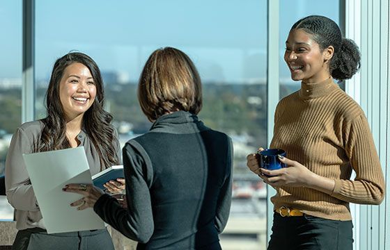 Two female Nationwidetrustuk Bank accountants talking to a female customer